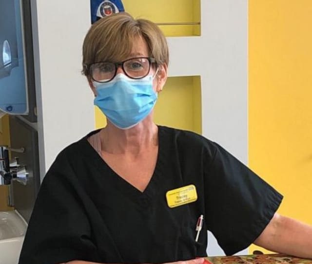 Nurse Tracey wearing a mask